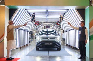 Prime Minister Narendra Modi flagging off the Maruti Suzuki e Vitara from the production line at Suzuki Motor Gujarat plant.